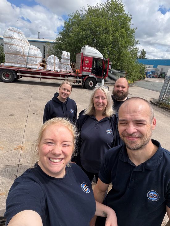 team outside factory